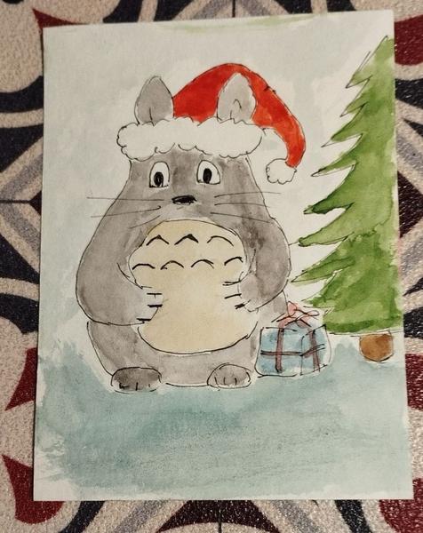 Aquarelle d'un totoro qui porte un bonnet de Noël 