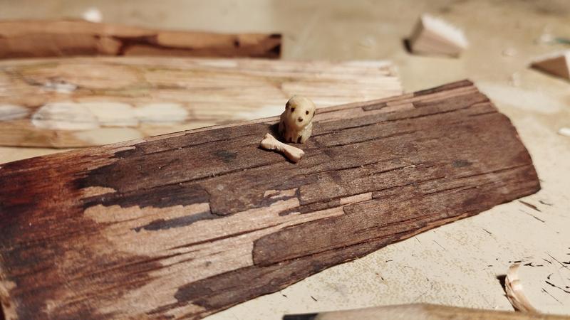 Mini sculpture de chien et son os