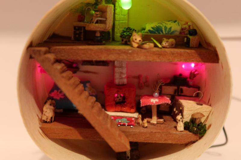 tiny doll house inhabited by rabbits and foxes