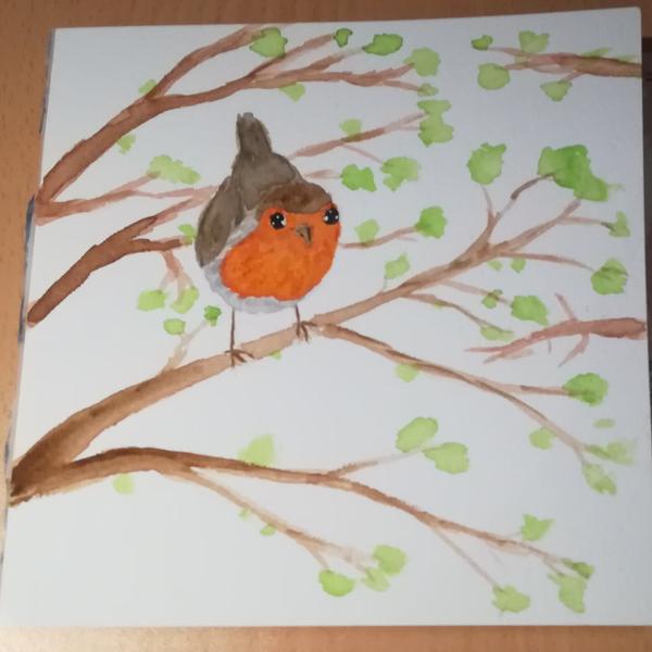 Aquarelle d'un rouge-gorge posé sur une branche 